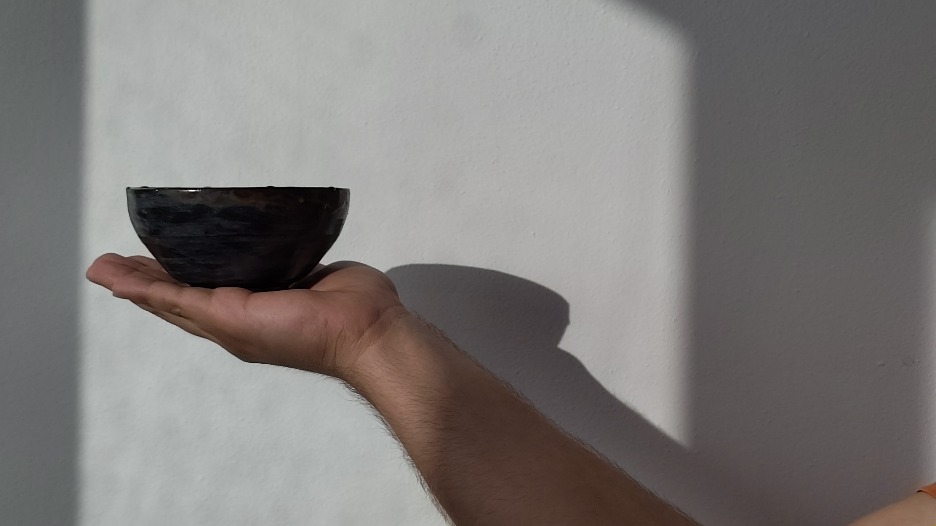 Hands cradling a warm cup of tea